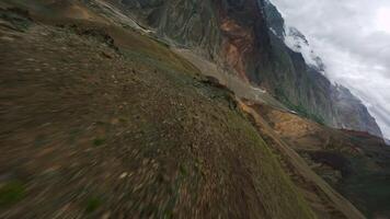 Himalayan mountains and green hills aerial view, FPV drone flight video