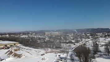 An aerial view of a city with snow on the ground video