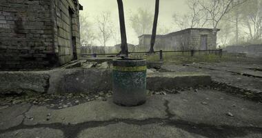 Abandoned area with a rusty trash can next to decaying buildings video