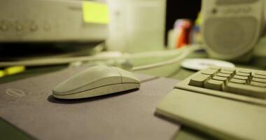 Workstation setup featuring a computer mouse and keyboard with office items video