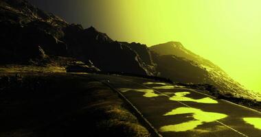 Mysterious mountainous road reflecting vibrant colors during sunset video