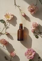 bottle of brown rose oil surrounded by pink roses on beige background creates serene and elegant atmosphere photo