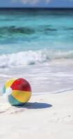 colorful beach ball rests on white sandy shore, surrounded by gentle waves and serene ocean backdrop photo