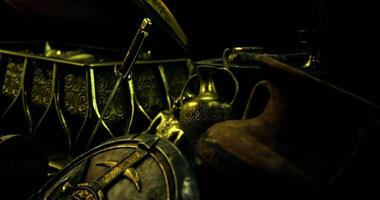 Ancient treasures and artifacts displayed in a dark setting video