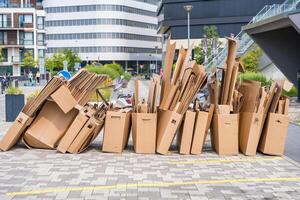 Stacked cardboard boxes prepared for recycling in an urban area in Prague photo
