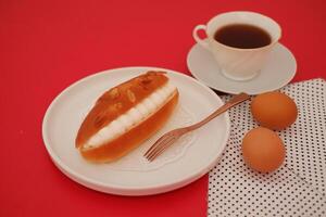 Sweet Cream-Filled Bun with Almond Topping photo