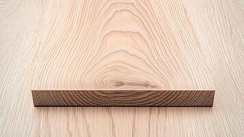 Close-up view of a wooden plank showcasing natural grain patterns on a smooth surface photo