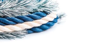 Close-up view of colorful twisted ropes and tinsel, showcasing texture and detail on a white background photo