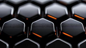 Close-up view of glossy black hexagonal patterns with orange accents, showcasing modern design photo