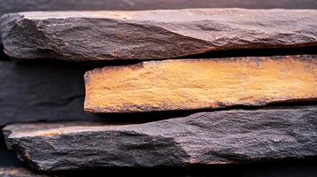 Close-up view of layered dark and orange stones creating a textured surface, ideal for backgrounds photo