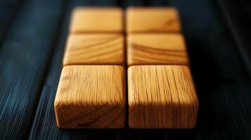 Close-up view of polished wooden blocks arranged on a dark wooden surface, showcasing texture photo