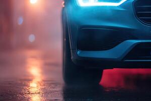 A sleek car with its headlights shining brightly pierces through a soft fog, providing visibility and reassurance in a mysterious night setting photo