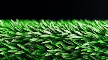 Close-up view of vibrant green artificial grass showcasing texture and detail against a dark backdrop photo