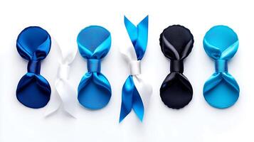 Collection of five elegant ribbon bows in varying shades of blue and white on a clean background photo