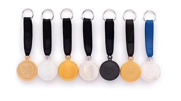 Collection of medals displayed in a row, showcasing various colors and designs, isolated on white photo