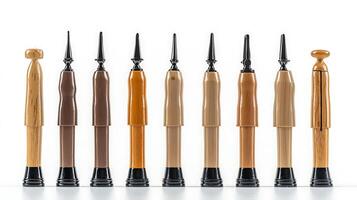 Collection of various wooden and plastic pen designs displayed in a clean, modern setting photo