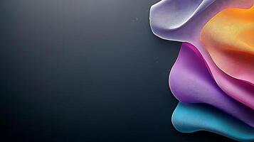 Colorful abstract fabric waves flowing gracefully against a dark background, creating a serene atmosphere photo