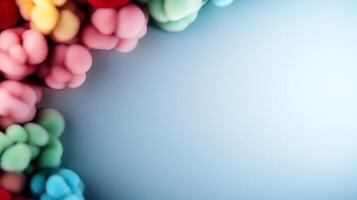 Colorful abstract shapes creating a vibrant border against a soft blue background photo