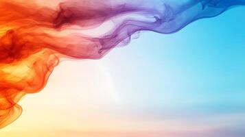 Colorful abstract smoke waves blending into a serene blue sky, creating a tranquil atmosphere photo