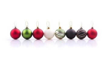 Colorful assortment of Christmas ornaments arranged in a row on a reflective surface photo