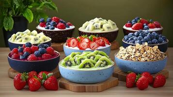 Colorful assortment of fresh fruits and yogurt bowls arranged on a wooden table with greenery photo
