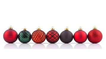 Colorful assortment of holiday ornaments arranged in a row on a reflective surface photo