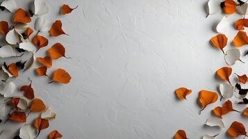 Colorful autumn leaves scattered on a textured white background, creating a serene and artistic ambiance photo