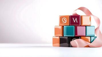 Colorful building blocks arranged creatively with a ribbon, symbolizing playfulness and creativity photo