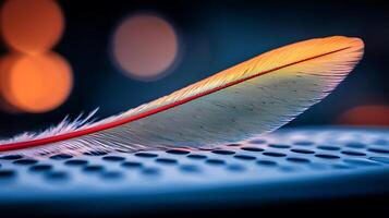 Colorful feather resting on a speaker, with blurred lights creating a vibrant background photo