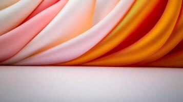 Colorful flowing fabric drapes in shades of pink, orange, and white, creating a soft texture backdrop photo