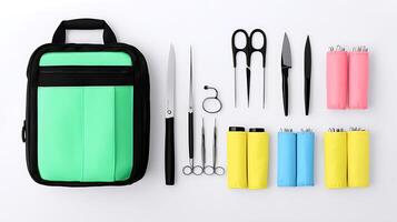 Colorful kit with various tools including scissors, knives, and lighters on a white background photo