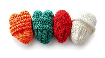Colorful knitted hearts in vibrant hues arranged in a row, showcasing craftsmanship and warmth photo