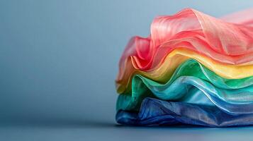 Colorful layers of translucent fabric elegantly arranged on a soft background, showcasing texture and light photo