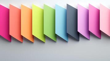 Colorful paper sheets arranged in a gradient pattern against a soft background, ideal for design photo