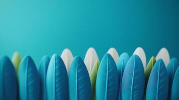 Colorful plastic leaves arranged in a vibrant backdrop, creating a playful and artistic scene photo