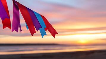 Colorful ribbons sway gently in the breeze at sunset by the beach, creating a serene atmosphere photo