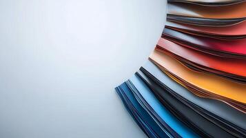 Colorful sheets of paper arranged in a circular pattern against a light background photo