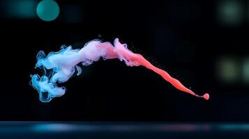 Colorful smoke swirl gracefully disperses in a dark background, creating a mesmerizing visual effect photo