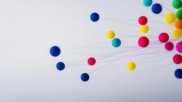 Colorful spheres and strands on a minimalist background, creating a dynamic visual effect photo