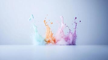 Colorful splashes of paint in vibrant hues creating an artistic display on a neutral background photo
