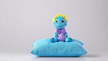 Colorful toy dinosaur sitting on a blue pillow against a plain background, inviting playfulness photo