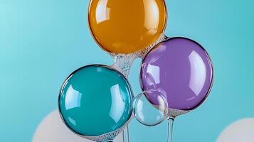 Colorful translucent bubbles floating against a soft blue background, creating a playful atmosphere photo