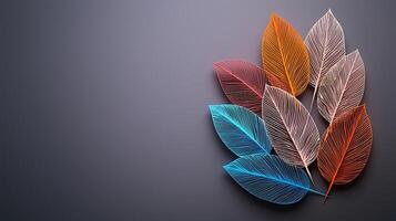 Colorful translucent leaves arranged artistically on a smooth surface, creating a serene backdrop photo