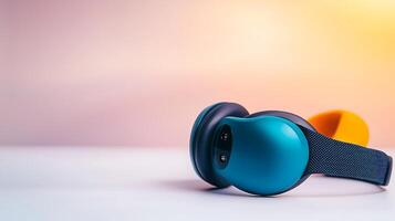 Stylish wireless headphones resting on a smooth surface with a soft gradient background photo