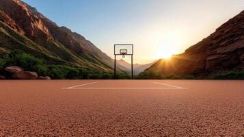 Sunset over a basketball court surrounded by mountains, capturing a serene and active atmosphere photo