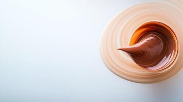 Swirling chocolate and caramel mixture in a bowl, showcasing texture and color gradients photo