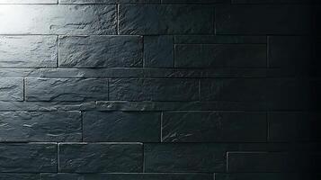 Textured dark stone wall illuminated from the left, creating shadows and depth effects photo