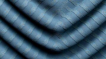 Textured blue fabric with wave-like patterns, showcasing intricate details and soft hues photo