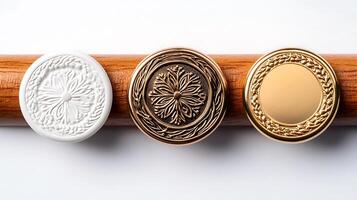 Three decorative medallions in white, bronze, and gold displayed on a wooden surface, showcasing intricate designs photo