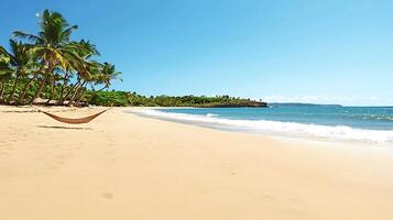 Tranquil beach scene with a hammock, palm trees, and gentle waves under a clear blue sky photo